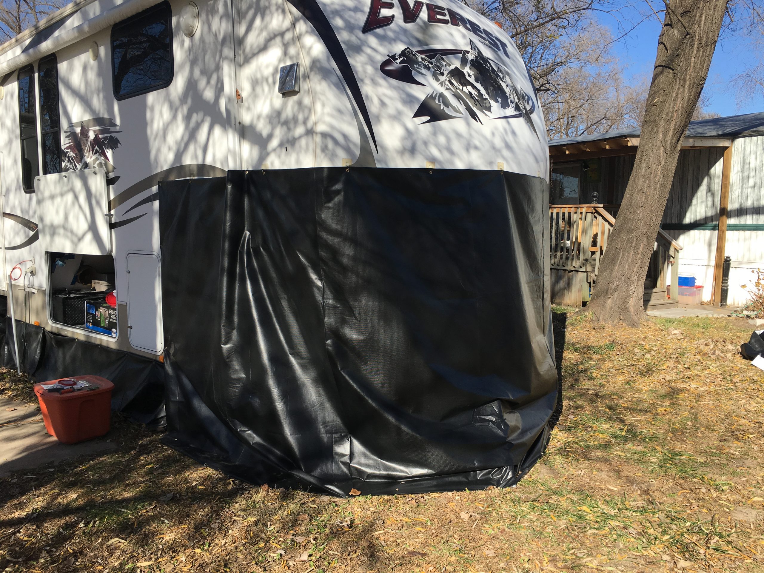 How We Made 200 DIY Vinyl RV Skirting for Winter Camping