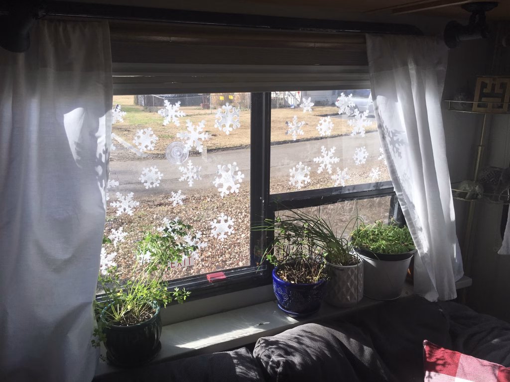 Snowflakes stenciled on RV windows - RV Christmas Decor idea
