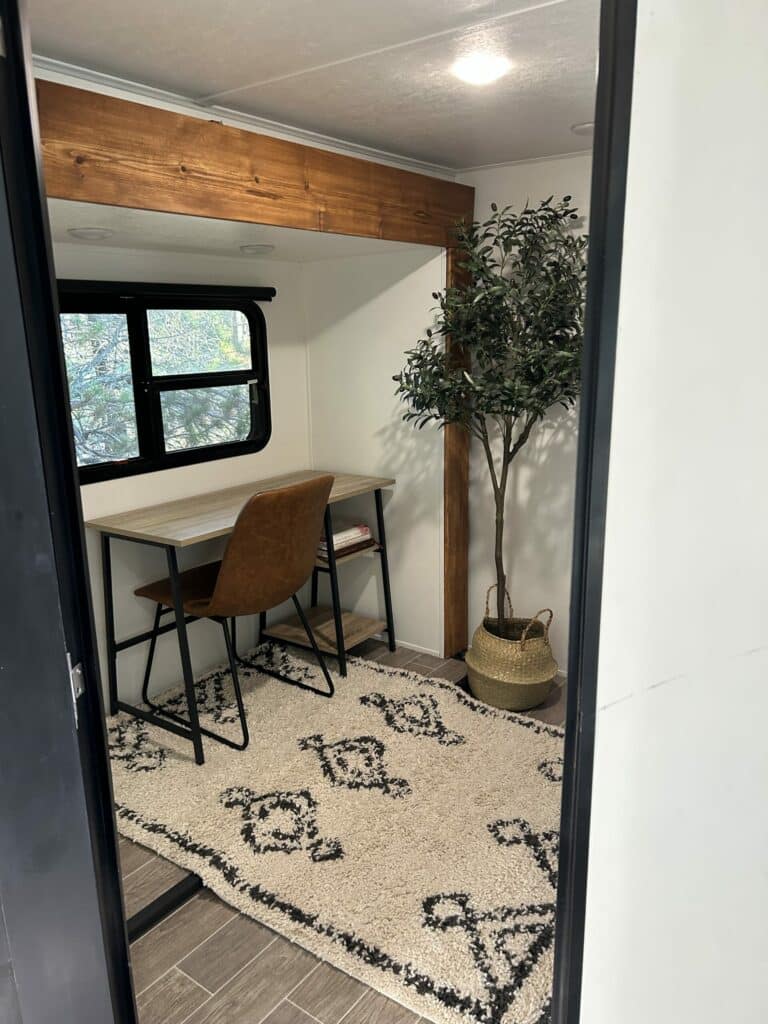 Rustic flat-board RV slideout trim in a natural wood finish by Alicia Velasco