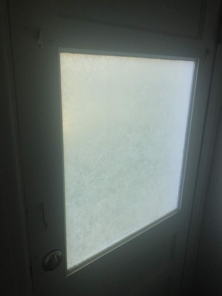 Window covered with transluscent privacy film